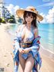 A woman in a blue kimono and a straw hat on the beach.